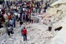 In this image made from amateur video released by the Ugarit News and accessed Wednesday, April 25, 2012, purports to show Syrians standing in rubble of damaged buildings from Syrian forces shelling in Hama, Syria. Syrian state media said Thursday that anti-regime bomb-makers accidentally set off blasts a day earlier that flattened parts of a residential area in the central city of Hama and killed several people. (AP Photo/Ugarit News via AP video) TV OUT, THE ASSOCIATED PRESS CANNOT INDEPENDENTLY VERIFY THE CONTENT, DATE, LOCATION OR AUTHENTICITY OF THIS MATERIAL