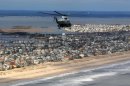 Marine One, carrying President Barack Obama and New Jersey Gov. Chris Christie, take an aerial tour of the Atlantic Coast in New Jersey in areas damaged by superstorm Sandy, Wednesday, Oct. 31, 2012. (AP Photo/Doug Mills, Pool)