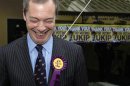 UK Independence Party (UKIP) leader Nigel Farage smiles as he leaves the UKIP campaign office in Eastleigh
