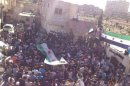 Residents gather during the funeral of Hussein Omish in Jubar