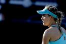Eugenie Bouchard, from Canada, prepares to serve to Lauren Davis during a match at the Family Circle Cup tennis tournament in Charleston, S.C., Wednesday, April 8, 2015. Davis won 6-3, 6-1 to defeat the number one seed Bouchard. (AP Photo/Mic Smith)