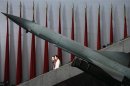 Visitors walk past a Chinese-made missile at the Military Museum in Beijing