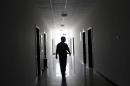 A drug addict walks at a compulsory drug rehabilitation center in Kunming