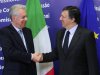 European Commission President Jose Manuel Barroso, right, welcomes Italy's Prime Minister Mario Monti, at the European Commission headquarters in Brussels, Friday, April 27, 2012. (AP Photo/Yves Logghe)