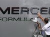 A mechanic of Mercedes Formula One team polishes a truck in the paddock ahead of the weekend's Belgian F1 Grand Prix in Spa Francorchamps