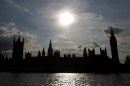 The Houses of Parliament are silhouetted against a setting sun in central London on August 29, 2013