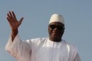 FILE - In this July 7, 2013 file photo, presidential candidate Ibrahim Boubacar Keita waves to supporters during a campaign rally at the March 26 Stadium, in Bamako, Mali. The former prime minister has won Mali's presidency after his opponent conceded defeat before official results were announced. Soumaila Cisse went late Monday, Aug. 12 to Keita's home to congratulate him on his victory, according to spokesmen for both candidates. (AP Photo/Harouna Traore)
