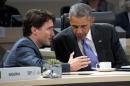 Canadian Prime Minister Justin Trudeau talks with President Barack Obama during the afternoon plenary session of the Nuclear Security Summit, Friday, April 1, 2016, in Washington. (AP Photo/Alex Brandon)