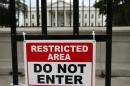 File photo of a sign posted on a fence outside the White House in Washington