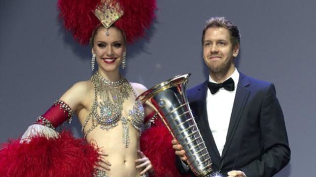 Sebastian Vettel holds his trophy at the 2013 FIA Prize Giving gala in Saint-Denis (Reuters)
