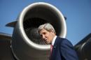 US Secretary of State John Kerry boards a cargo plane at Queen Alia International Airport in Amman, on June 24, 2014
