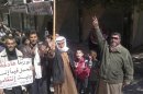 Handout photo of demonstrators protesting against Syria's President Bashar Al-Assad in Kafranbel near Idlib