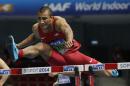 United States' Ashton Eaton clears a hurdle in the 60m hurdles of the men's heptathlon during the Athletics Indoor World Championships in Sopot, Poland, Saturday, March 8, 2014. (AP Photo/Matt Dunham)