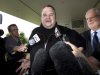 FILE - In this Feb. 22, 2012 file photo, Kim Dotcom, the founder of the file-sharing website Megaupload, comments after he was granted bail and released in Auckland, New Zealand.  On his way up, he fooled them all: journalists, judges, investors and companies. Then the man who renamed himself Kim Dotcom finally did it. With an eye for get-rich schemes and an ego gone wild, he parlayed his modest computing skills into a mega-empire, becoming the fabulously wealthy computer maverick he had long claimed to be. (AP Photo/New Zealand Herald, Brett Phibbs, File) NEW ZEALAND OUT, AUSTRALIA OUT