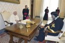 Pope Francis talks with the Coptic Orthodox leader Tawadros II during a private audience in the pontiff's library at the Vatican