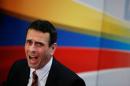 Venezuelan opposition leader and Governor of Miranda state Henrique Capriles talks to the media during a news conference in Caracas