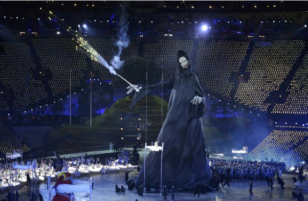 Performers take part in the opening ceremony of the London 2012 Olympic Games at the Olympic Stadium