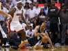 Spurs' Parker slips while being guarded by Heat's James during Game 1 of their NBA Finals basketball playoff in Miami