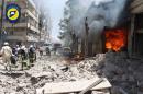 FILE - This file photo taken on June 8, 2016 provided by the Syrian Civil Defense Directorate in Liberated Province of Aleppo, which has been authenticated based on its contents and other AP reporting, shows Syrian civil defense workers, left, gather at a street which attacked by warplanes, in Aleppo, Syria. Fierce fighting and airstrikes continue in Syria's northern city of Aleppo as insurgents try to break a siege on opposition-held eastern districts in a counteroffensive to government advances. But Syria's war, now in its sixth year, is raging beyond Aleppo, claiming dozens of lives every day. (Civil Defense Directorate in Liberated Province of Aleppo via AP, File)