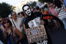 A demonstrator dresses as an skeleton during a protest against government austerity measures in Madrid