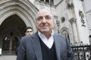 FILE - In this Wednesday, March, 10, 2010 file photo, self-exiled oligarch Boris Berezovsky leaves the High Court in London after winning his libel case against a Russian broadcaster that accused him of masterminding the murder of a former Russian agent in London. Russia's transition from a Kremlin-controlled economy to a free market in the 1990s brought on a wave of contract killings as criminals, entrepreneurs, and corrupt officials tried muscle each other out of lucrative businesses. The recent death of 67-year old Boris Berezovsky, which remains unexplained, has revived fears that the assassins that have long stalked oligarchs and opposition figures back in Russia have been making their home in the U.K. (AP Photo/Alastair Grant, File)
