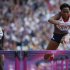 Britain's Tiffany Porter races against Ivory Coast's Rosvitha Okou during their round 1 women's 100m hurdles at the London 2012 Olympic Games in the Olympic Stadium