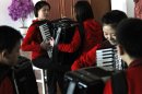 In this Feb. 25, 2012 photo, students rehearse with accordions in a practice room at the Kumsong school in Pyongyang, North Korea. A group from the school became an Internet sensation with their accordion version of 1980's pop group A-ha's 