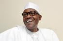 Leading opposition All Progressives Congress presidential candidate Mohammadu Buhari laughs during an interview on February 6, 2015 in Abuja