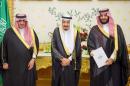 Saudi Crown Prince Mohammed bin Nayef, Saudi King Salman, and Saudi Arabia's Deputy Crown Prince Mohammed bin Salman stand together after Saudi Arabia's cabinet agrees to implement a broad reform plan known as Vision 2030 in Riyadh