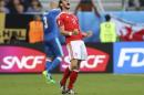 Wales's Gareth Bale celebrates at the end of the Euro 2016 Group B soccer match between Wales and Slovakia, at the Nouveau stadium in Bordeaux, France, Saturday, June 11, 2016. Wales won 2-1. (AP Photo/Andrew Medichini)
