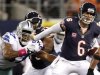 Bears quarterback Cutler is pressured by Cowboys linebacker Butler in the first half of their NFL football game in Arlington