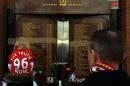 On April 15, 2013 a child wears a Jersey bearing the writing "Justice for the 96" in front of the Hillsborough Memorial at Liverpool FC's Anfield football ground in Liverpool, north-west England