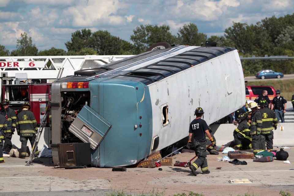 Firefighters work to extricate people from a bus crash Saturday, July 27, 2013 in Indianapolis. The Indianapolis Fire Department says three people were killed when a bus carrying teens from a church camp crashed on a busy thoroughfare near Interstate 465. The bus was carrying 40 passengers who are members of Colonial Hill Baptist Church and were returning from camp when the crash happened Saturday afternoon. (AP Photo/The Indianapolis Star, Michelle Pemberton) NO SALES