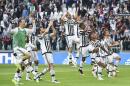 Juventus' players celebrate their 4-0 win over Palermo at the end of a Serie A soccer match at the Juventus Stadium in Turin, Italy, Sunday, April 17, 2016. Juventus continued its march towards a fifth successive Serie A title as it beat relegation-threatened Palermo 4-0 to move nine points clear on Sunday. (Andrea Di Marco/ANSA via AP)