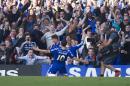 Chelsea's Eden Hazard, celebrates after scoring against Manchester United, during the English Premier League soccer match between Chelsea and Manchester United, at Stamford Bridge Stadium in London, Saturday, April 18, 2015. (AP Photo/Bogdan Maran)