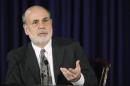 U.S. Federal Reserve Chairman Bernanke responds to reporters during his final planned news conference before his retirement, at the Federal Reserve Bank headquarters in Washington