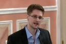 An image grab from a video released by Wikileaks on October 12, 2013 shows US intelligence leaker Edward Snowden speaking during a dinner with US ex-intelligence workers and activists in Moscow on October 9, 2013