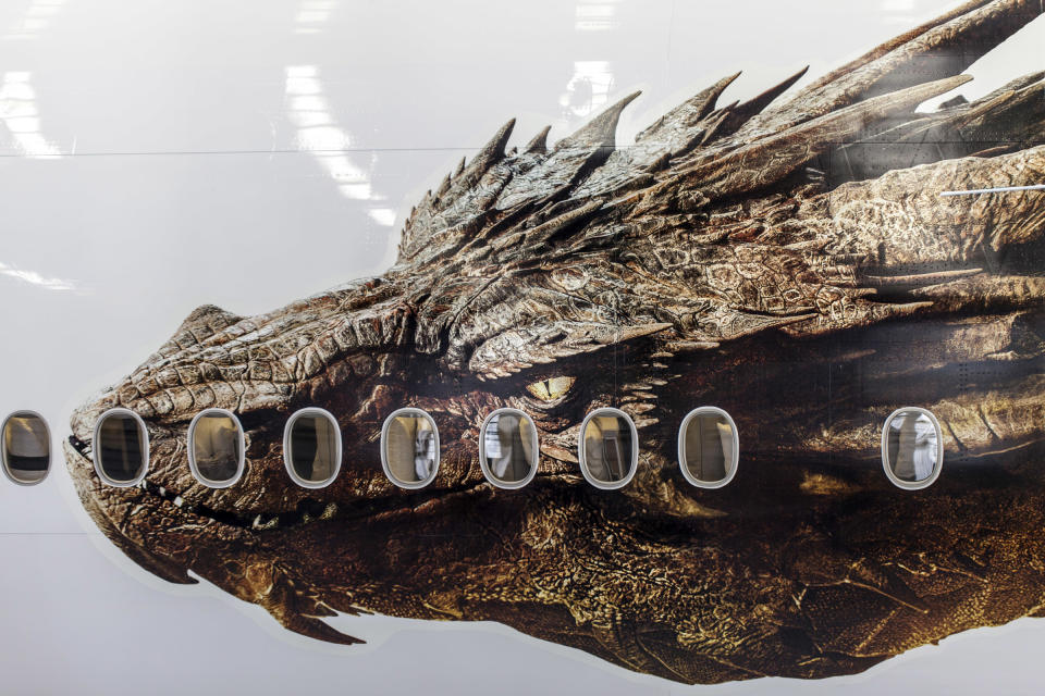 In this photo taken Friday, Nov. 29, 2013, released by Air New Zealand, an image of the dragon Smaug from Peter Jackson's Hobbit trilogy is shown on the side of an Air New Zealand plane in Auckland, New Zealand. The image was unveiled to celebrate the premiere of "The Hobbit: The Desolation of Smaug," which screens Monday in Los Angeles. (AP Photo/Air New Zealand)