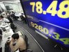 Currency traders work under a screen indicating the exchange rate, above, of the U.S. dollar against Japanese yen and the Nikkei 225 index, at a foreign exchange firm in Tokyo, Wednesday, Feb. 15, 2012. The dollar was at a three-month high against the Japanese yen after the Bank of Japan said it would increase its economic stimulus program as Asian stock markets surged Wednesday after Greece indicated a willingness to commit to spending cuts to secure its bailout. (AP Photo/Shizuo Kambayashi)