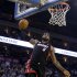 Miami Heat's LeBron James (6) dunks against the Golden State Warriors during the first half of an NBA basketball game in Oakland, Calif., Wednesday, Jan. 16, 2013. James on Wednesday became the youngest player in NBA history to score 20,000 points. (AP Photo/Marcio Jose Sanchez)