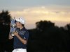 Justin Rose, of England, poses with the trophy after winning the U.S. Open golf tournament at Merion Golf Club, Sunday, June 16, 2013, in Ardmore, Pa. (AP Photo/Julio Cortez)