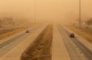 Cars navigate along the Marsha Sharp Freeway during a dust storm in Lubbock, Texas, Wednesday, Dec. 19, 2012.(AP Photo/Lubbock Avalanche-Journal, Zach Long) ALL LOCAL TV OUT