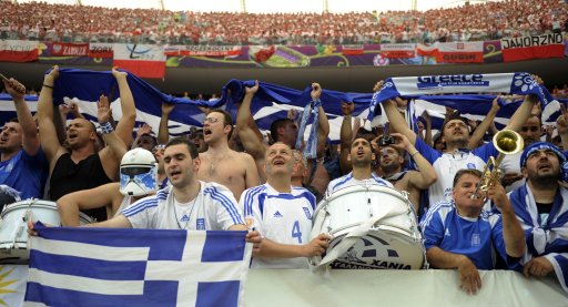 Greek fans cheer before the start of their Group A Euro 2012 soccer match against Poland in Warsaw