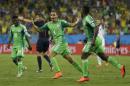 Nigeria's Peter Odemwingie, centre, celebrates after scoring his side's opening goal during the group F World Cup soccer match between Nigeria and Bosnia at the Arena Pantanal in Cuiaba, Brazil, Saturday, June 21, 2014. (AP Photo/Kirsty Wigglesworth)