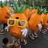 In this photo taken on Saturday, Aug. 6, 2011, a total of 49 people dressed in giant carrot costumes dance on a square before Pang Kun, one of the 49 carrots, proposes to his girlfriend in Qingdao in east China's Shandong province. According to Chinese news reports and photos posted online Pang has spent three weeks and 100,000 yuan ($15,000) for his wedding proposal to his girlfriend, assisted by his 48 friends, on China's Valentine's Day which fell on Aug. 6. (AP Photo) CHINA OUT