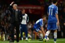 Chelsea's Jose Mourinho (L) reacts at Old Trafford in Manchester, northwest England, on August 26, 2013