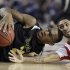 Wichita State's Carl Hall (22) and Louisville's Russ Smith vie for the loose ball during the second half of the NCAA Final Four tournament college basketball semifinal game, Saturday, April 6, 2013, in Atlanta. (AP Photo/Charlie Neibergall)
