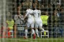Real Madrid's Gareth Bale, left, is followed by Real Madrid's Luka Modric as he celebrates after scoring a goal during a Spanish La Liga soccer match between Real Madrid and Levante at the Santiago Bernabeu stadium in Madrid, Spain, Sunday, March 15, 2015. (AP Photo/Daniel Ochoa de Olza)