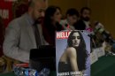 The editorial staff of Hello magazine address a news conference during its launching ceremony at National Press Club in Islamabad, Pakistan on Saturday, March 24, 2012. Pakistan is better known for bombs than bombshells, militant compounds than opulent estates. A few enterprising Pakistanis hope with the launch of a local version of the well-known celebrity magazine Hello! (AP Photo/B.K. Bangash)