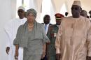 Nigeria President Muhammadu Buhari, left, Liberia President, Ellen Johnson Sirleaf, second left, and Senegal President Macky Sall, right, arrive for a meeting in Abuja, Nigeria, Monday, Jan. 9, 2017. Officials say Nigeria's President Muhammadu Buhari will lead three West African heads of state to Gambia on Wednesday in an effort to persuade its longtime leader to step down.(AP Photo/ Azeez Akunleyan)